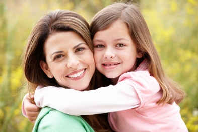 Mother and child smiling happily